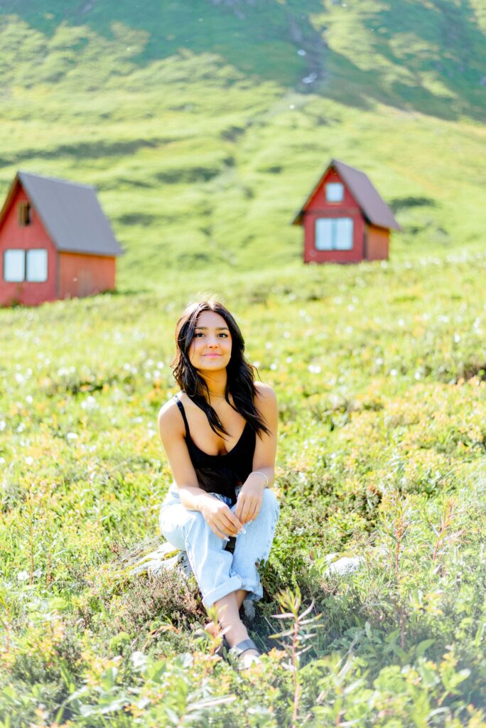 Mountains at hatcher pass with greenery and two red cabins